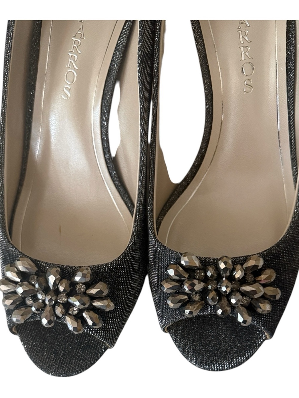 Caparros peep-toe heels feature a silver gray finish w/crystal brooch, size 9.5
